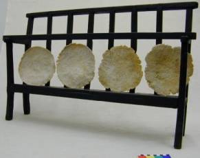 Manfi Cakes drying on a traditional Manfi rack